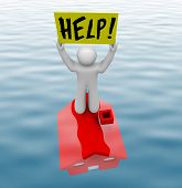 stock photo of home  - A man stands on a home underwater holding sign reading Help - JPG 