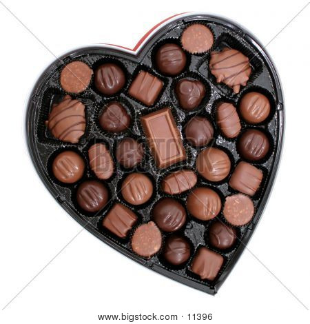 Heart shaped box of dark and light assorted chocolates.