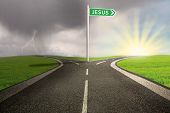 image of religion  - Highway with green road sign of Jesus name on stormy background - JPG 