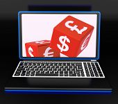 foto of currency  - Currencies Dices On Laptop Showing Global Finances And Forex - JPG 