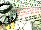 foto of health  - Concept of the cost of health care and medical expenses in the United States with one dollar bill and pills - JPG 