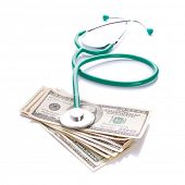 picture of cash  - Doctor stethoscope with cash in dollars over white - JPG 