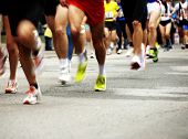 picture of competition  - detail of the legs of runners at the start of a marathon race - JPG 