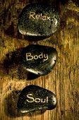 stock photo of soul  - wellness and reiki concept with three black massage stones with words soul - JPG 