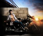 picture of fitness  - Sexy young fit male model on motorcycle outdoors at dawn - JPG 