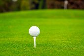 stock photo of golf  - Golf ball on tee in a beautiful golf club - JPG 