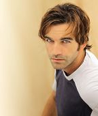 stock photo of males  - Portrait of a casual good looking male model with striking blue eyes - JPG 