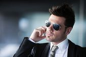 picture of business people  - Young businessman in urban background - JPG 