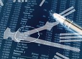 picture of clockface  - Conceptual image of clockface overlaid onto financial figures - JPG 