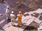 stock photo of construction worker  - Three workers at the construction site - JPG 
