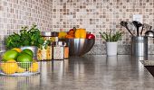 picture of food  - Modern kitchen countertop with food ingredients and green herbs - JPG 