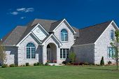 image of blue sky  - Beautiful white brick home featuring some fantastic brick details - JPG 