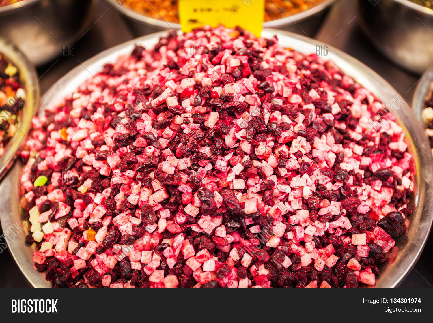 Different types of herbal tea with slices of dried fruit on the counter