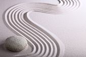 stock photo of zen  - zen garden japanese garden zen stone with raked sand and round stone tranquility and balance ripples sand pattern - JPG 
