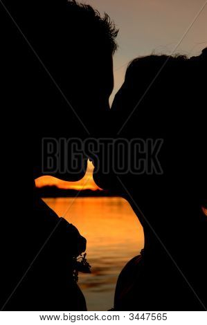 couple kissing sunset. this couple kissing This