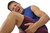 picture of sports  - Male athlete clutching his hamstring in excruciating pain on white background - JPG 