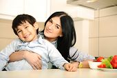stock photo of time  - Happy mother and little son in the kitchen - JPG 