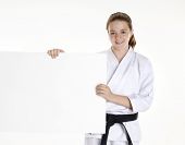 foto of art  - Martial arts girl holding a white panel - JPG 