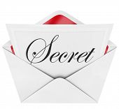 image of confidential  - An envelope revealing a note with the handwritten cursive word Secret - JPG 