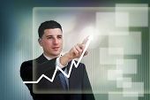 image of business people  - Businessman highlighting business growth on a graph - JPG 