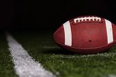 pic of competition  - Football resting on the first down line - JPG 