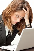 picture of pressure  - Stressed businesswoman working at her notebook - JPG 