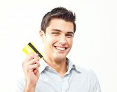 image of man  - Young man happy holding credit card - JPG 
