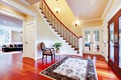 image of entrance  - Luxury home entrance with cherry hardwood floor and staircase - JPG 