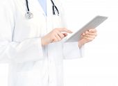 stock photo of science  - Doctor in white coat with stethoscope holding and touching on digital tablet pc - JPG 