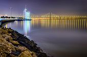 image of bridge  - The modern Park of the Nations area in Lisbon at night with the Vasco da Gama bridge in the background - JPG 