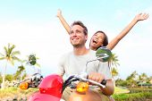 foto of nature  - Happy free freedom couple driving scooter excited on summer holidays vacation - JPG 