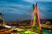 stock photo of stay  - Most famous bridge in the city at dusk Octavio Frias De Oliveira Bridge Pinheiros River Sao Paulo Brazil - JPG 