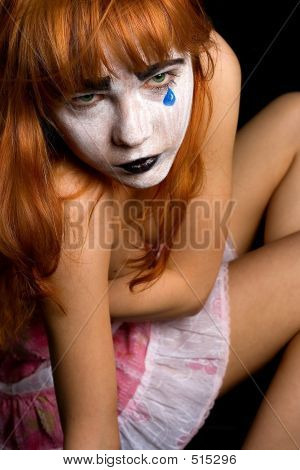 sad clown-face makeup girl. download preview