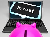 stock photo of investment  - Invest Key On Laptop Showing Investment Market And Monetary Growth - JPG 