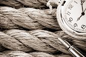 image of watch  - pocket watch with ink pen on ship ropes - JPG 