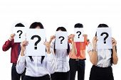 image of business concept  - Business colleagues holding question mark signs in front of their faces - JPG 