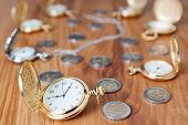 picture of watch  - Group gold pocket watch against the euro coins - JPG 