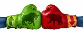 stock photo of investment  - Stock market trading business concept with two boxing gloves with arrows going up and down with bull and bear icon emblems stitched to the glove as investment decisions and financial success - JPG 