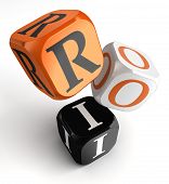 image of investment  - return on investment orange black dice blocks on white background - JPG 