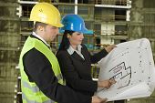 image of construction  - Engineer and client looking on project on the construction site - JPG 