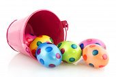 pic of over white  - Easter eggs in fallen pink bucket over white - JPG 