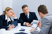 image of meeting  - Business team working and discussing together their business plan at meeting in office - JPG 