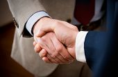 image of handshake  - Two professional businessman giving handshake in the office - JPG 