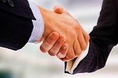 picture of handshake  - Business handshake between office bulding - JPG 