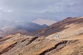 image of pass  - Road in Himalayas in clouds near Tanglang la Pass   - JPG 