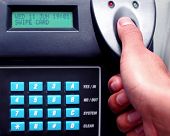 picture of security  - A Man Placing His Thumb On Thumbprint Security System - JPG 