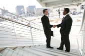 picture of business people  - A business team shaking hands in agreement - JPG 