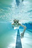 stock photo of competition  - underwater shot of boy swimming laps in pool - JPG 