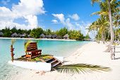 pic of exotic  - Polynesian wedding boat with chair at exotic beach - JPG 