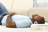 pic of home  - Portrait of casual guy relaxing with music on headphones at home - JPG 